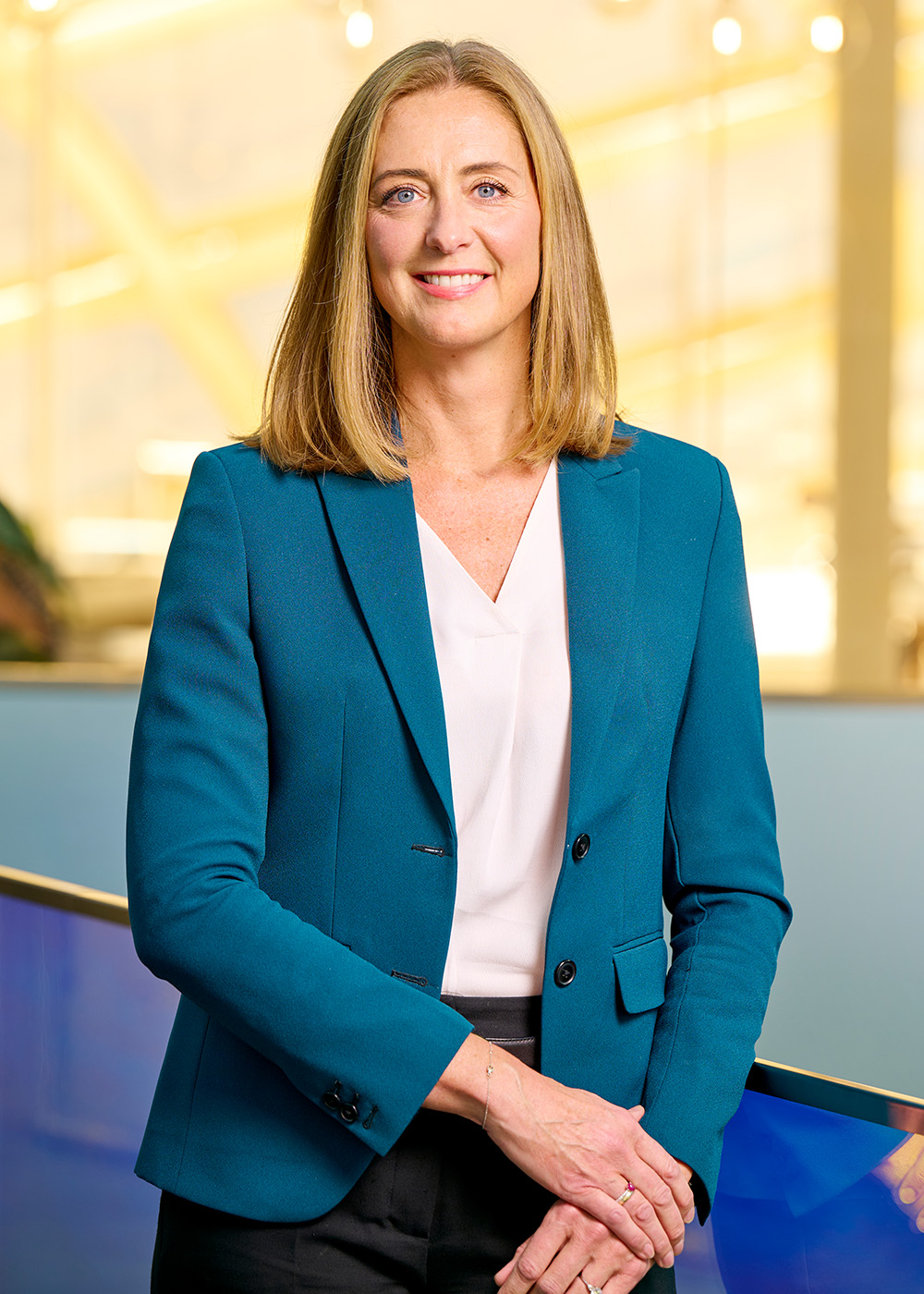 Caroline Vagner Rosenstand in suit, smiling.