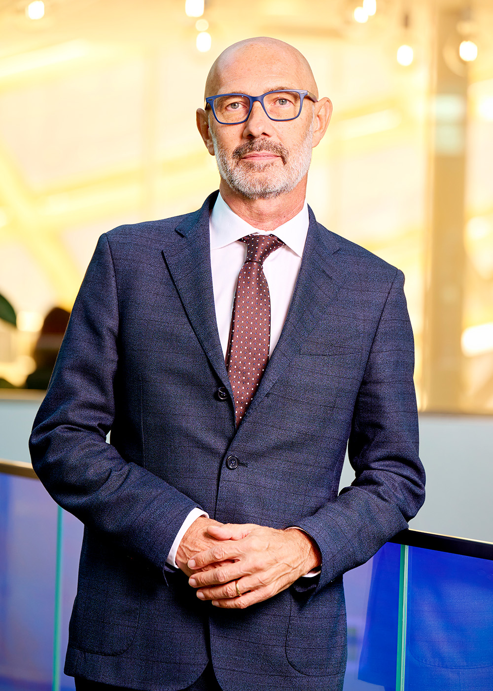 John Hansveden in suit, smiling.